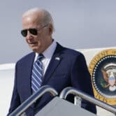 Joe Biden exits Air Force One as he arrives at Hancock Field Air National Guard Base in Mattydale, N.Y.