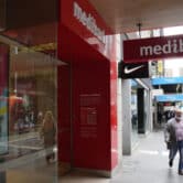 People walk past a Medibank branch in Sydney.
