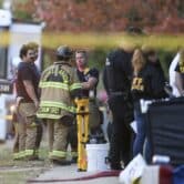 Police and firefighters investigate the scene of a house fire with multiple fatalities in Oklahoma.
