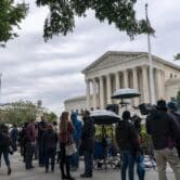 People gather at the Supreme Court