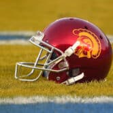 A USC helmet sits in the end zone prior to a college football game against UCLA.