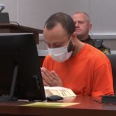 Darrell Brooks prays at his sentencing hearing.