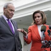 Chuck Schumer and Nancy Pelosi speak to reporters outside the White House.
