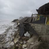 Parts of homes are seen collapsing on a beach in Florida due to Tropical Storm Nicole.
