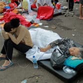 Earthquake survivors are treated outside of a hospital in Cianjur, West Java, Indonesia.