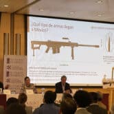 People speaking at a conference about arms trafficking