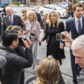 Elizabeth Holmes is photographed while walking to court with her partner and parents.