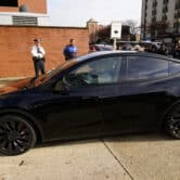 A Tesla with Elon Musk in the backseat arrives at a courthouse in Delaware.