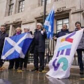Demonstrators hold Scottish flags outside the U.K. Supreme Court