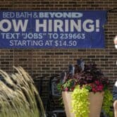 A now-hiring sign at a Bed, Bath & Beyond store
