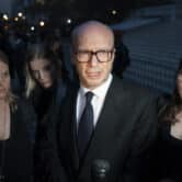Paul Haggis speaks to a reporter after leaving court in New York.