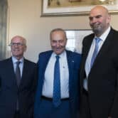 Peter Welch, Chuck Schumer and John Fetterman pose for a photo in the U.S. Capitol.