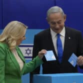 Sara and Benjamin Netanyahu cast their ballots during Israeli elections in Jerusalem.