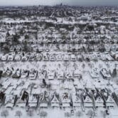 An aerial view of a neighborhood in Buffalo covered in snow after a blizzard.
