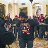 Trump supporters confront police during the Capitol riot.