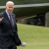 Joe Biden waves as he arrives on the South Lawn of the White House.