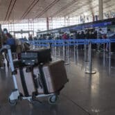 A masked traveler arrives at the Beijing Capital International Airport.