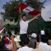 Supporters of Pedro Castillo gather outside a police base in Peru.