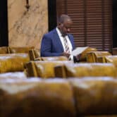 Ronnie Crudup looks at a paper in the House chamber at the Mississippi Capitol.