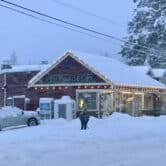 A person shovels snow outside a grocery store in Washington.