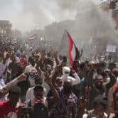 Sudanese demonstrators attend a political rally.