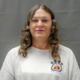 Amber McLaughlin poses for a photo in a detention center.