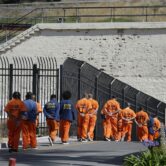 A line of prison inmates.