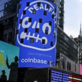 An ad for Coinbase is displayed on a screen in New York's Times Square.