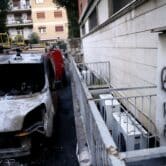 Burned cars are seen in the aftermath of an anarchist attack in Rome.