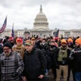 Proud Boys in orange hats rioting outside U.S. Capitol