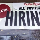 A now-hiring sign at a sushi restaurant outside Chicago.