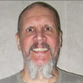 Scott Eizember poses for a photo at a correctional facility.