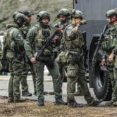 SWAT members stand near a SWAT vehicle in Atlanta.