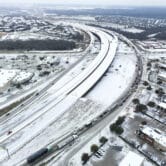 An icy mix covers a highway outside of Dallas.