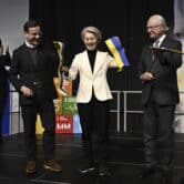 Ulf Kristersson, Ursula von der Leyen and Carl Gustaf stand on stage during an event in Sweden.