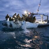 U.S. Navy sailors recover a surveillance balloon off the coast of South Carolina.