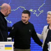 Charles Michel, Volodymyr Zelenskyy and Ursula von der Leyen look at each other while speaking during an event in Ukraine.