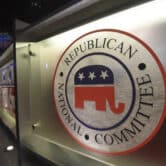 The Republican National Committee logo on a debate stage.
