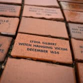 A series of red bricks, some of which with writing on them, in Connecticut.