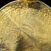 The inscription "He is Odin’s man" is seen on an ancient gold disk.