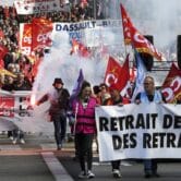 People demonstrate against pension reforms in France.