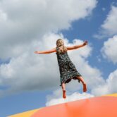 Girl jumps on bouncy platform