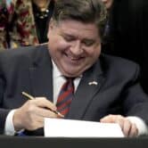 Illinois Gov. J.B. Pritzker signs the Paid Leave For All Workers Act into law.