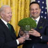 Joe Biden and Leo Varadkar hold a bowl of shamrocks at the White House.