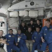 Astronauts gather together on the International Space Station.