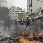 People set a fire during a demonstration in Dakar, Senegal.