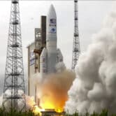 Smoke flows away from an Ariane rocket carrying the robotic explorer Juice takes off from Europe's Spaceport.