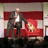 West Virginia Gov. Jim Justice pets his dog Babydog during an announcement for his U.S. Senate campaign.