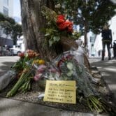 Flowers sit near the place where technology executive Bob Lee was fatally stabbed in San Francisco.