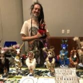 Artist displays animal dolls